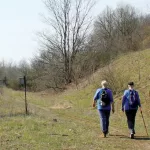 Hikers on trail in spring