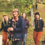 volunteers walking through forest
