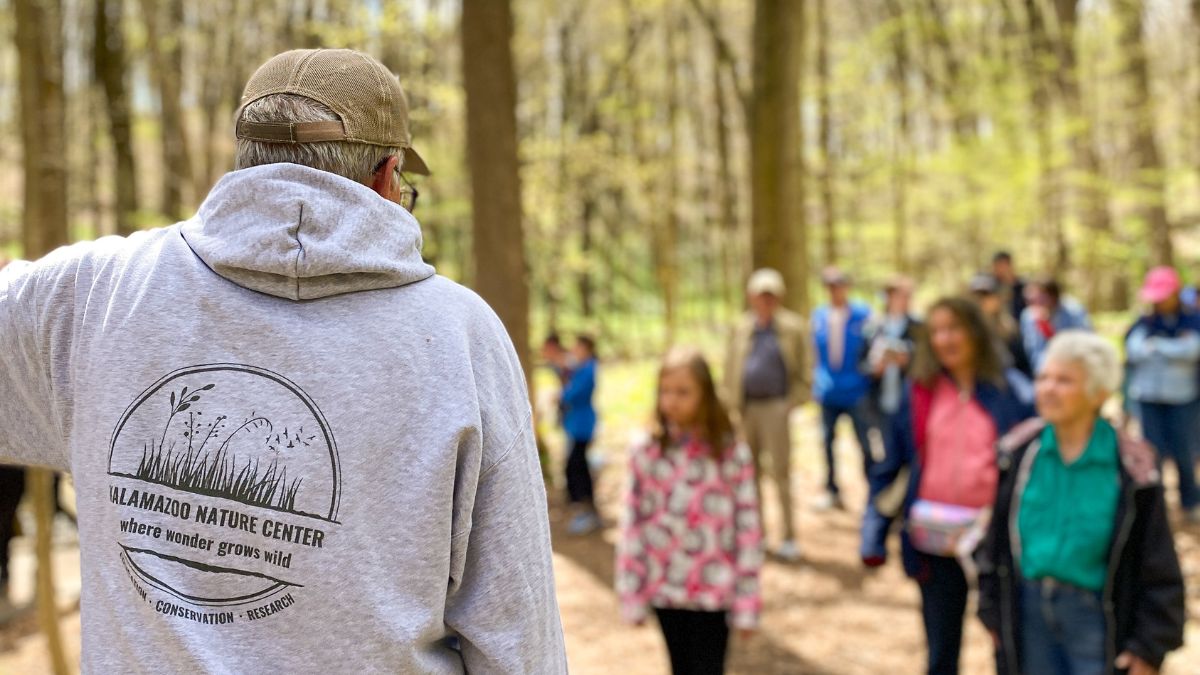 people outside in woods on a walk