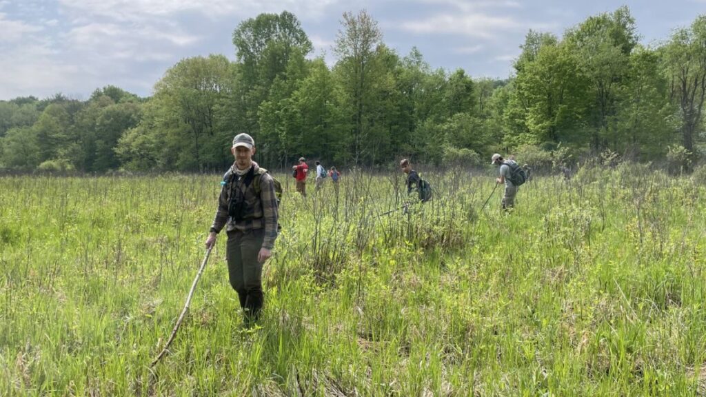 Research staff in green field