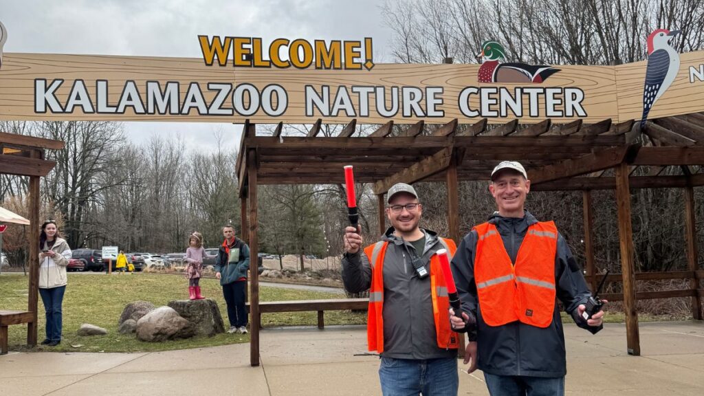volunteers wear vests as parking attendants